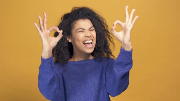 Portrait of Afro American Woman Showing Ok Sign