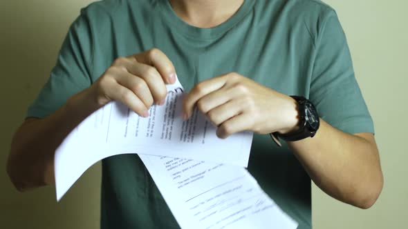 Man Tears The Document Contract alt