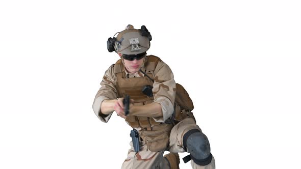 Soldier is Shooting with Hand Pistol Sitting on His Knee on White Background alt