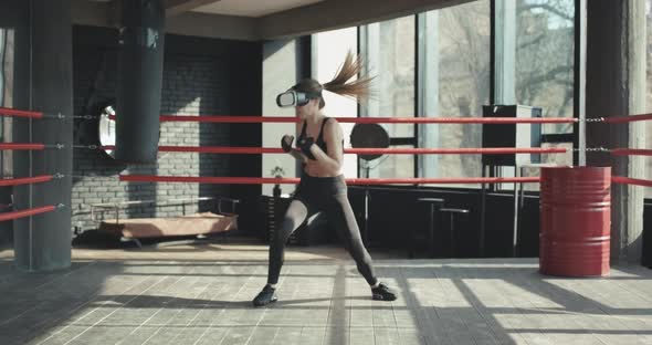 Woman in VR Headset Boxing Indoors alt