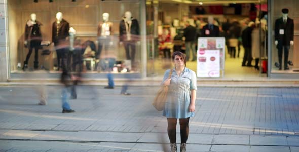 Young Woman Posing In Front Of Shopping Mall