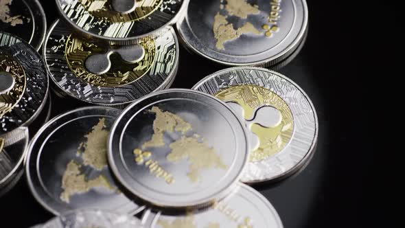 Rotating shot of Bitcoins (digital cryptocurrency) - BITCOIN RIPPLE  alt