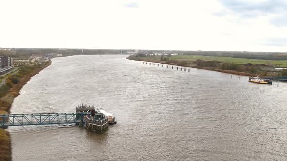 Docking station on the river Schelde in Antwerp Belgium on a moody overcast day. alt