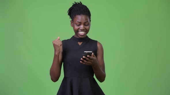 Young Beautiful African Businesswoman Using Phone