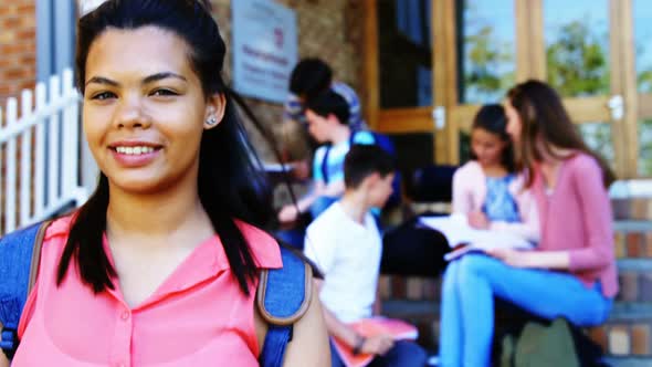 Portrait of smiling schoolgirl alt