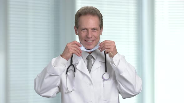 Male Doctor Uses the Stethoscope To Check Patient. alt