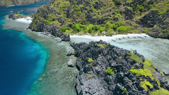 Aerial Drone Hover Footage Over Hidden Lagoon of Star Beach Rocks on Tapiutan Island Near Matinloc alt