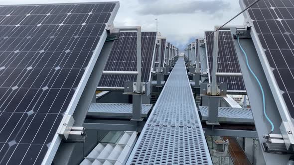 Solar panel station covering the roof of Telus garden building revealing the cityscape of Vancouver alt