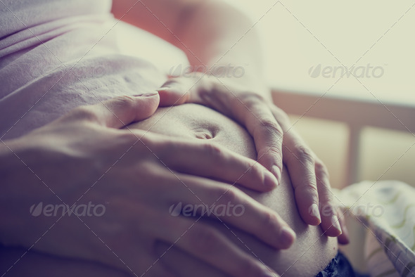 Bonding with unborn child - Stock Photo - Images