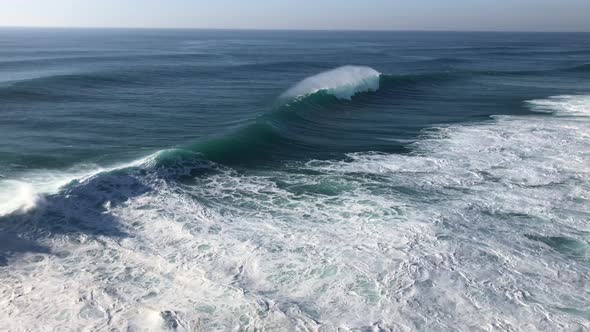 View from cliff of massive ocean waves