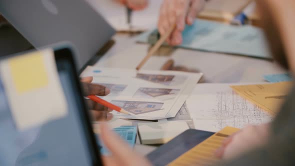 Close-up Shot of Development Design Project Company Employees Discussing Work Over Table with alt