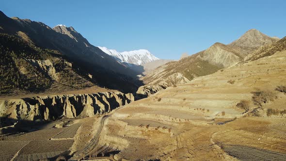 Aerial view of the terrace layers Manang looking through the valley alt
