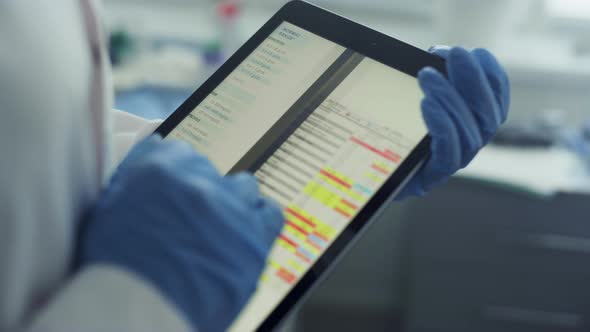 Doctor Hands Using Tablet Checking Health History Data in Tablet in Office alt