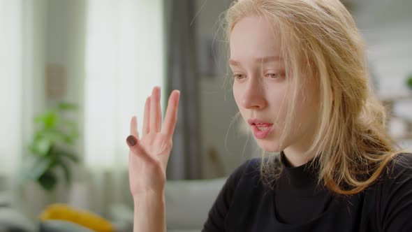 Young Beautiful Woman Learning Sign Language at Home in Living Room Using Online Lesson alt