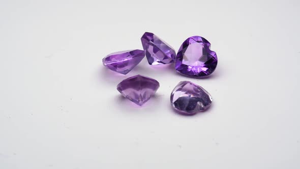Natural Amethysts Spin on the White Background