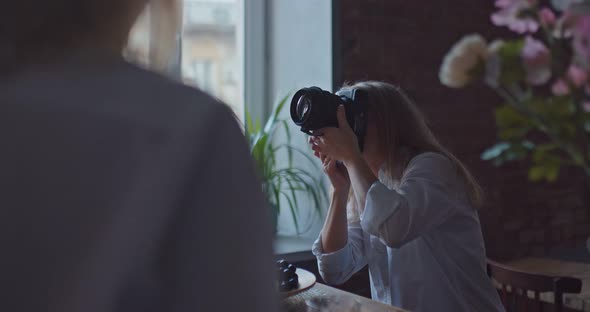 Woman Photographer Takes Pictures of Girls with Flowers and Fruits in the Studio alt
