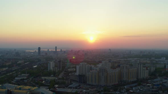 Aerial View of the Bright Orange Sunset Over the City. alt