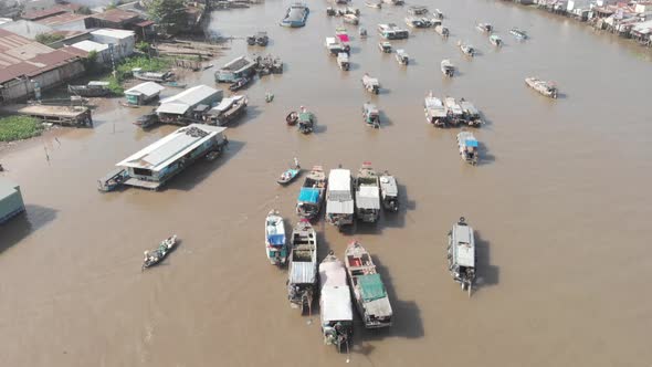 Aerial: flying over Cai Rang floating market Can Tho,  Vietnam alt