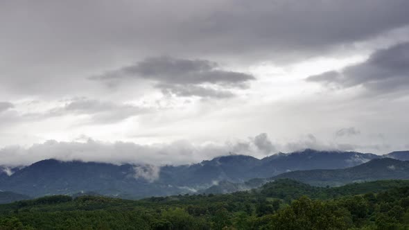 Dramatic Cumulus tropical cinematic cloudscape building up over the mountain turning into a tropical alt