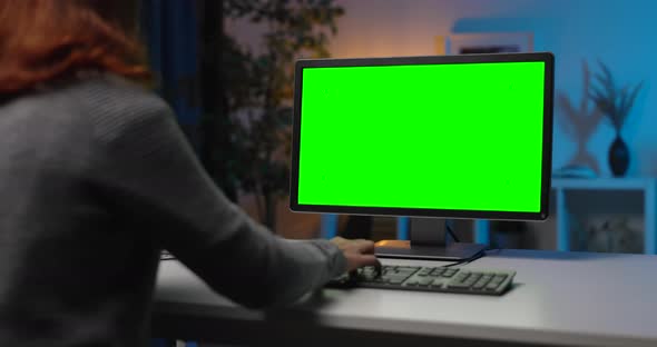 Woman Using Pc with Green Display
