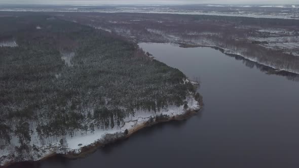 Russian Winter Lake with Shores Trees and Snow alt