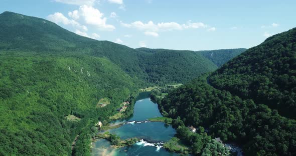 Aerial view of Una River between Croatia and Bosnia. alt