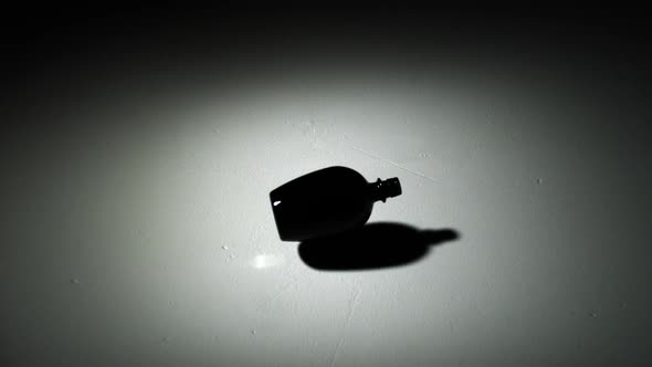 Smashing glass bottle of colorful sand, Slow Motion alt