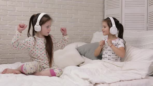 Little Child Baby Girl Listening To the Music with Headphones