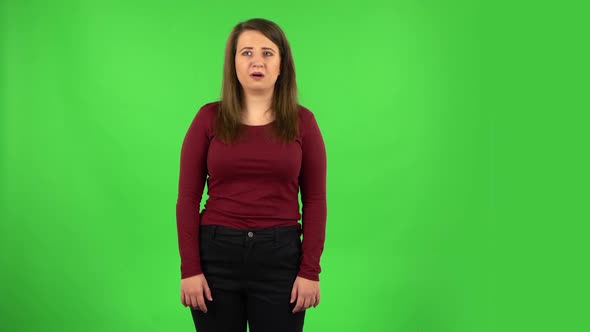 Frightened Girl Says Wow with Shocked Facial Expression, Green Screen alt