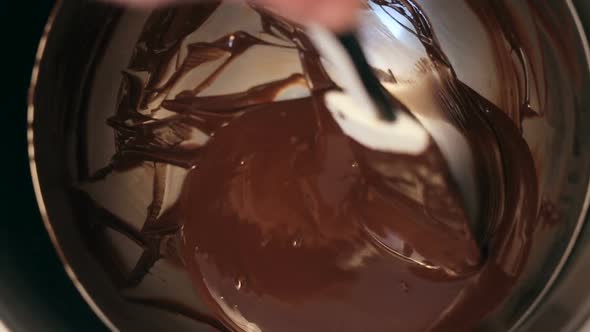Chef Baker Mixing Sweet Delicious Organic Melted Chocolate in Bowl