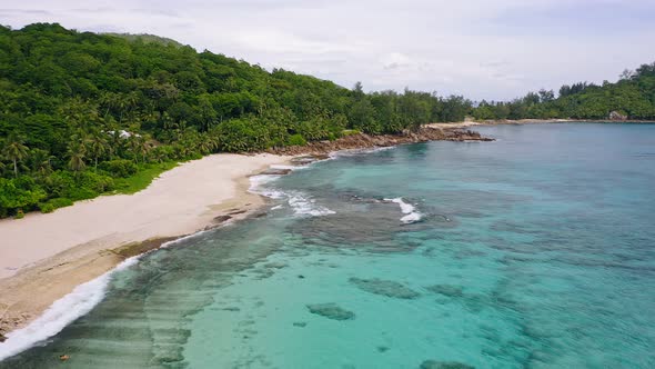 Aerial View of White Sand Paradise Tropical Beach Anse Bazarca at Mahe Island Seychelles alt