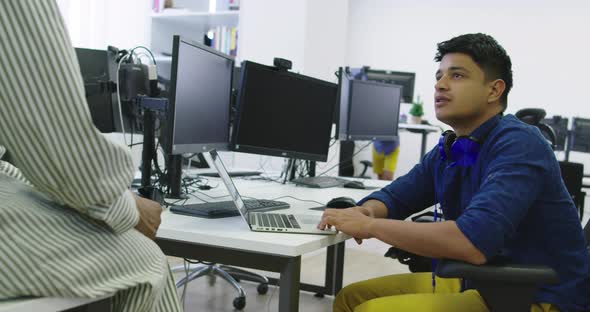 Ethnic People Working Together in Startup Office alt