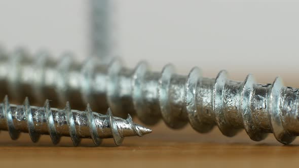 Video slider screws and nails for renovation work. A close-up of a metal screw.