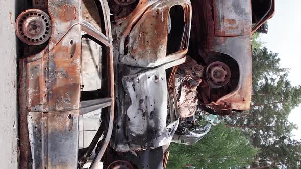 Vertical Video of Burnt and Shot Cars During the War in Ukraine alt