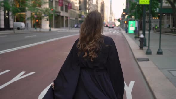 Girl in a Black Long Dress Runs Through Streets of Manhattan in New York
