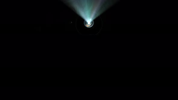 Video projector beam shining through smoke with jib moves alt