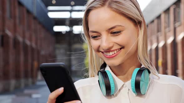 Happy Girl Business Woman Standing in City Street Looking Into Mobile Phone alt