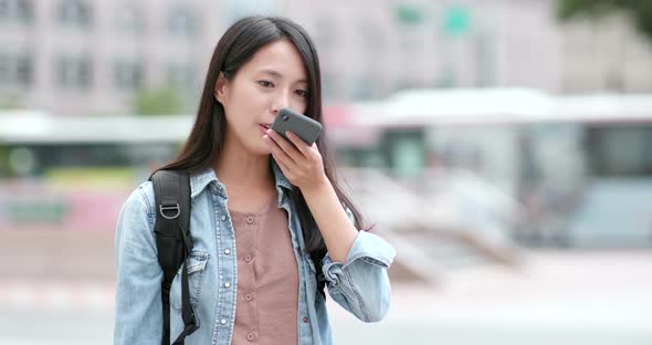 Woman travel in the city of Taiwan, use of mobile phone at outdoor alt