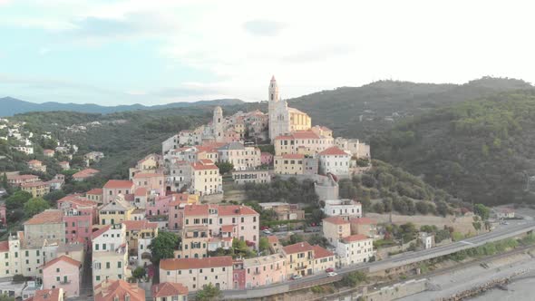 Aerial: flying around Cervo medieval town on the mediterranean coast, Liguria riviera, Italy alt