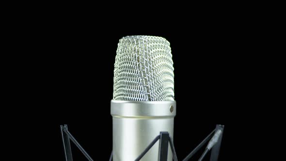 Studio Microphone with Spider Rotates on a Black Background alt