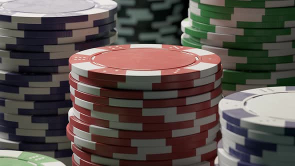 Casino chips or tokens in stacks on a green gaming table. Las Vegas gambling. alt
