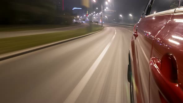 Drivelapse Urban Look From Fast Driving Car at a Night Avenue in a City Timelapse Hyperlapse alt