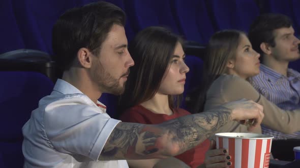 Two Young Couples Watching the Premiere of a New Film