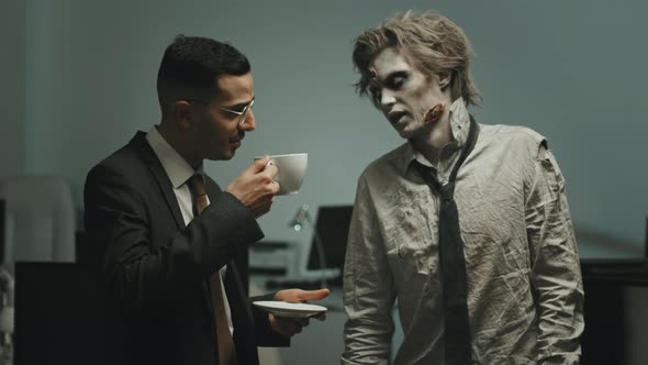 Polite Businessman Talking to Zombie Worker in Office alt
