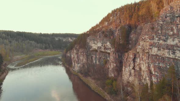 A View on Sunrise Mountain Covered in Trees and the River alt