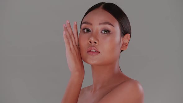 Portrait of attractive girl with soft make-up and tanned skin. alt