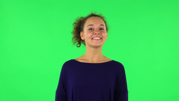 Portrait of Curly Woman in Anticipation of Worries, Then Disappointed, Green Screen alt