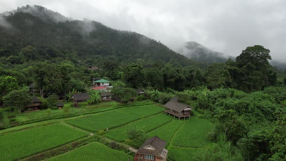 Aerial view of rural village in valley, Chiang Mai, Thailand by drone