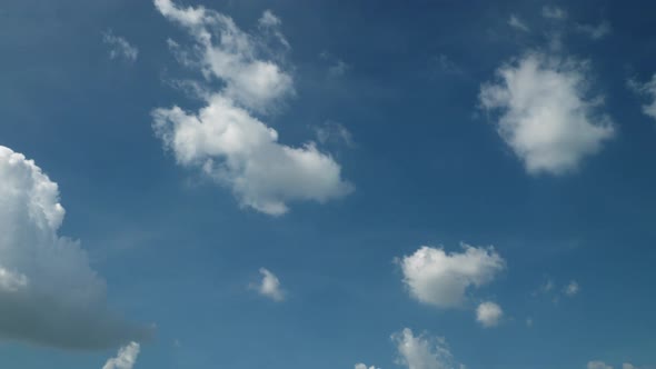 Clear blue sky with cloud and sunlight. 4K 29.97fps alt