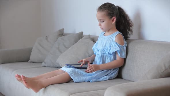 Happy Children Playing at Home Relaxing Use a Smartphone Cuddling Sit on Sofa Daughter and Son,look alt